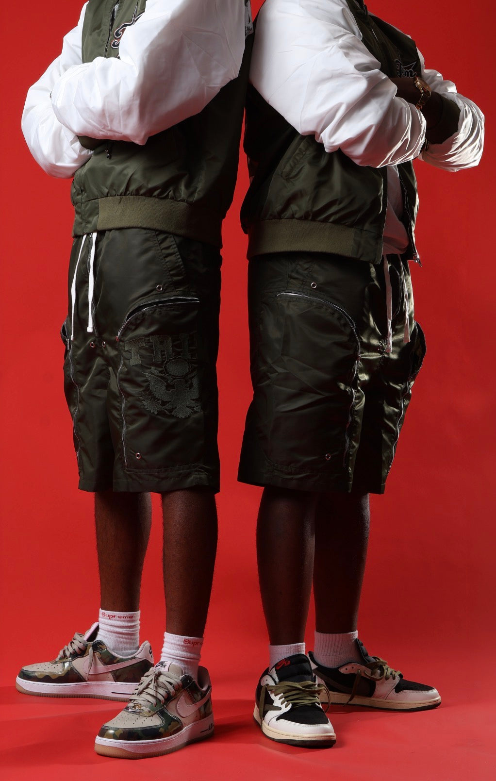 Green triple zip shorts