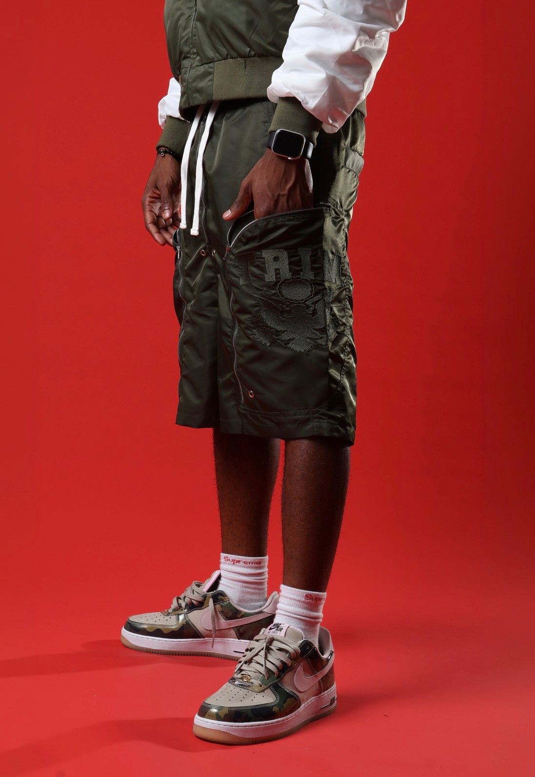 Green triple zip shorts