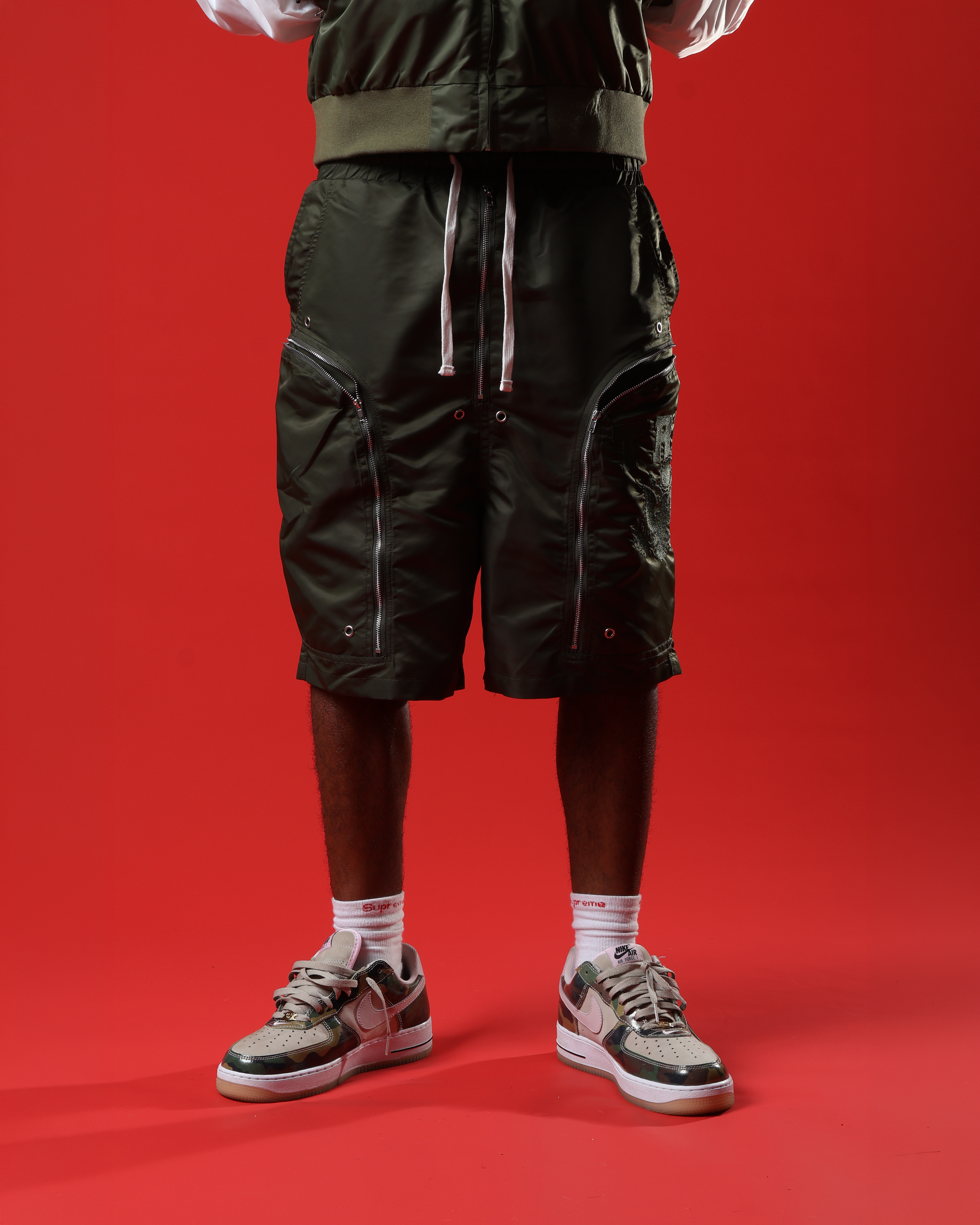 Green triple zip shorts